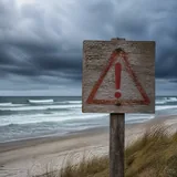 Danger warning sign on a beach