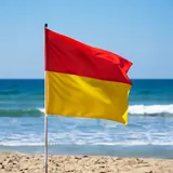 Safety and rescue flag on a surf beach