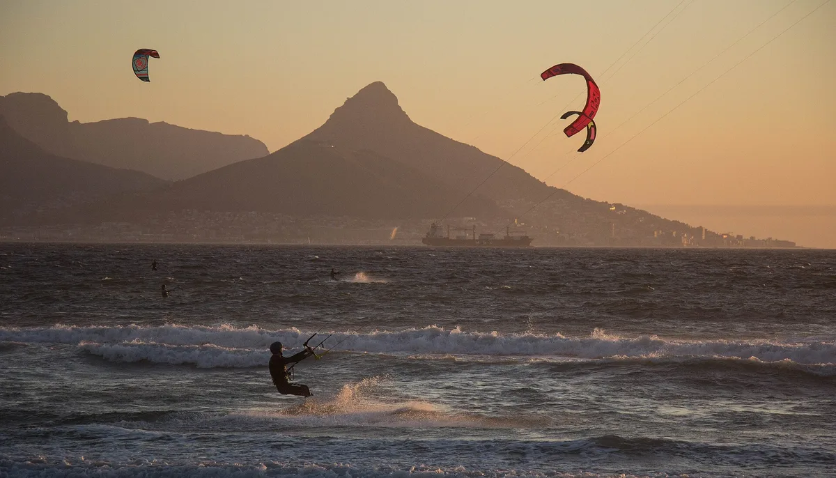 Kitesurfers at Bloubergstrand, Cape Town, with Table Mountain in the background