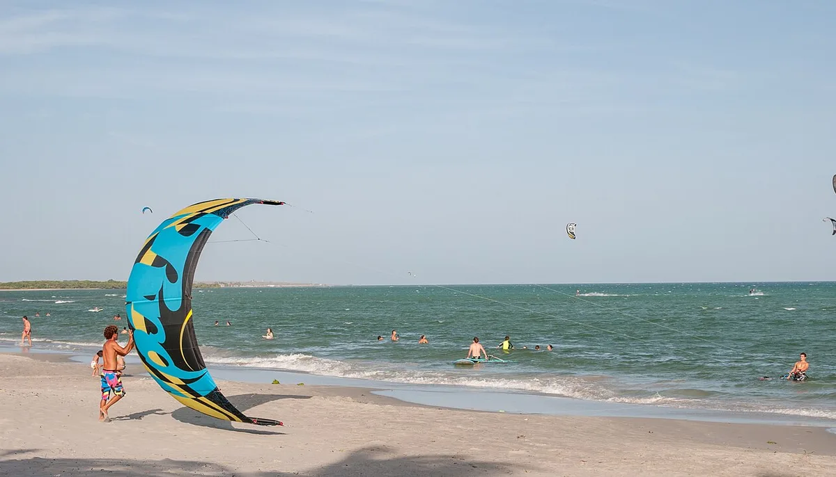 Kitesurfers launching in shallow water at El Yaque beach, Isla Margarita