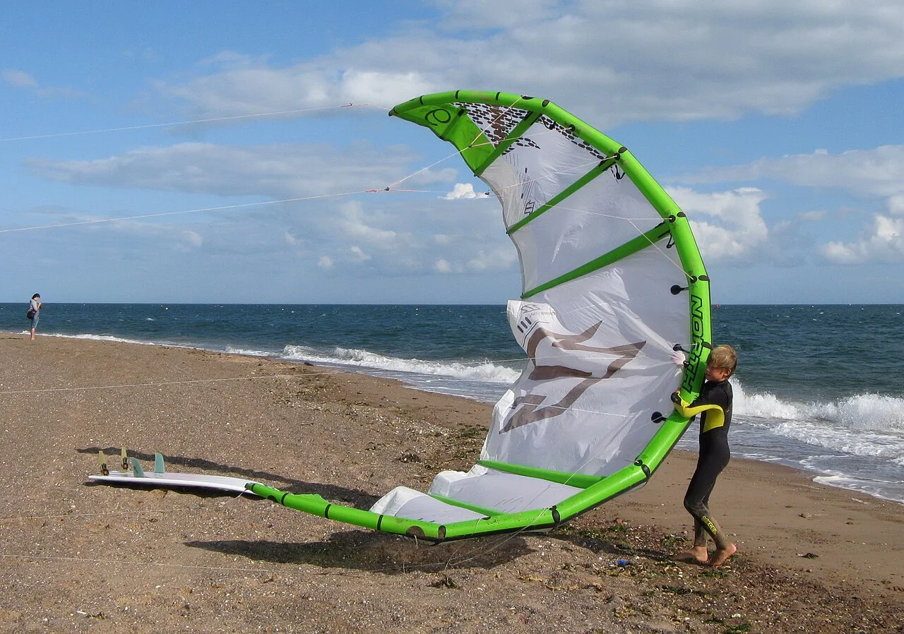 A kitesurfing kite laid out on the beach at Exmouth, Devon