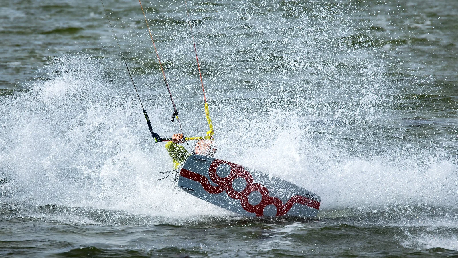 Kitesurfer in a spray of water at Fehmarn, Baltic Sea, Germany