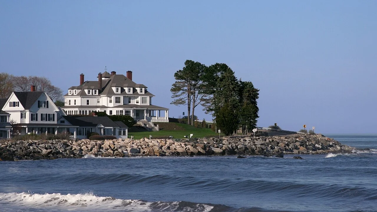 Waves breaking near a rocky point at Hampton Beach, New Hampshire