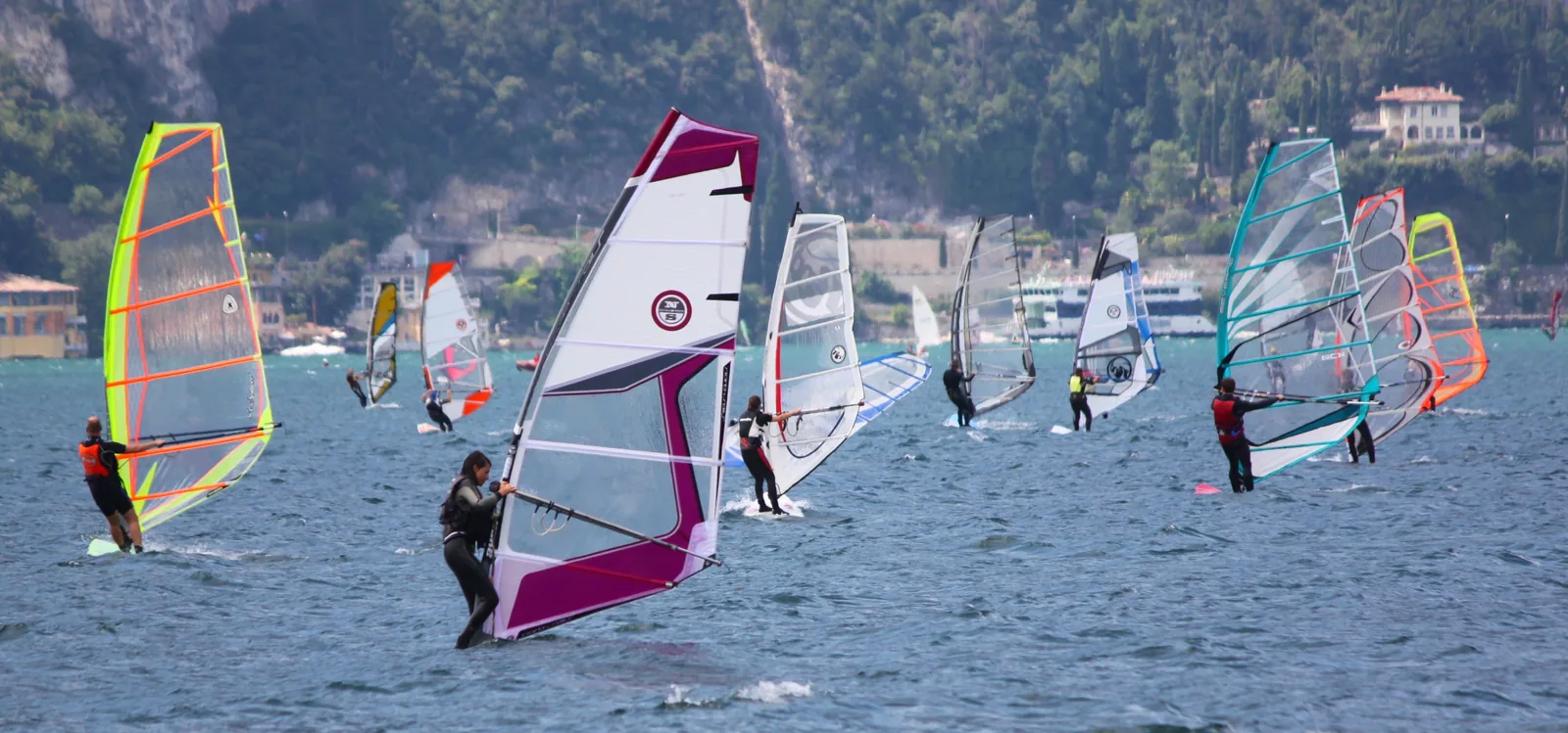 Windsurfers sailing on Lake Garda at Nago-Torbole