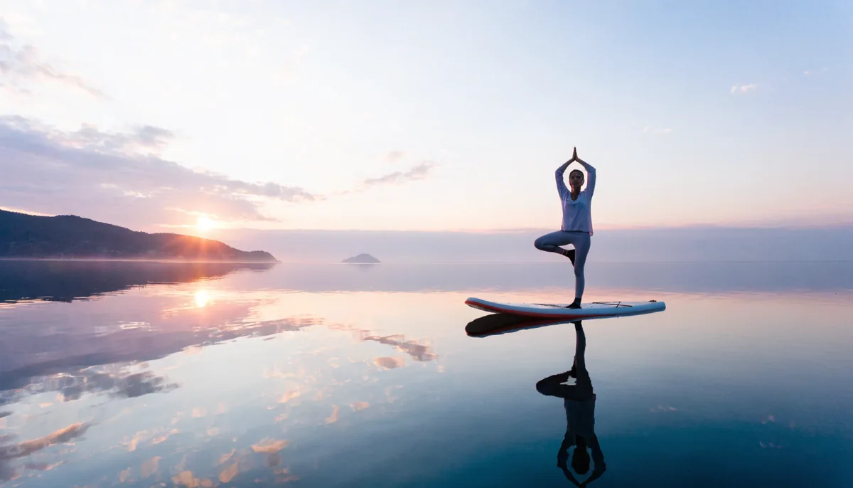 SUP fitness and yoga practitioners on their boards