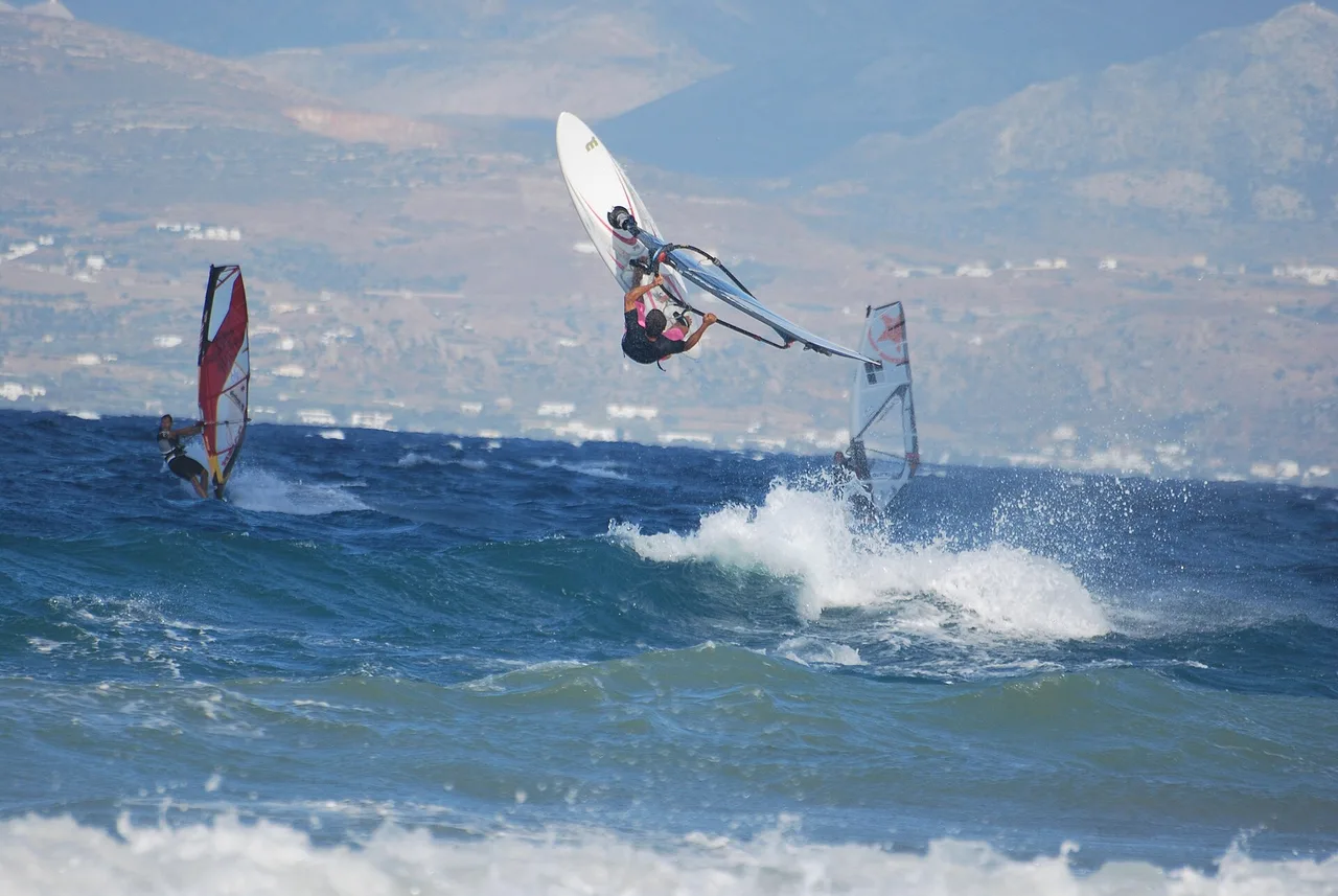 Windsurfers jumping and planing at Tsoukalia, on the east coast of Paros