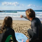 Surf school instructor teaching a lesson