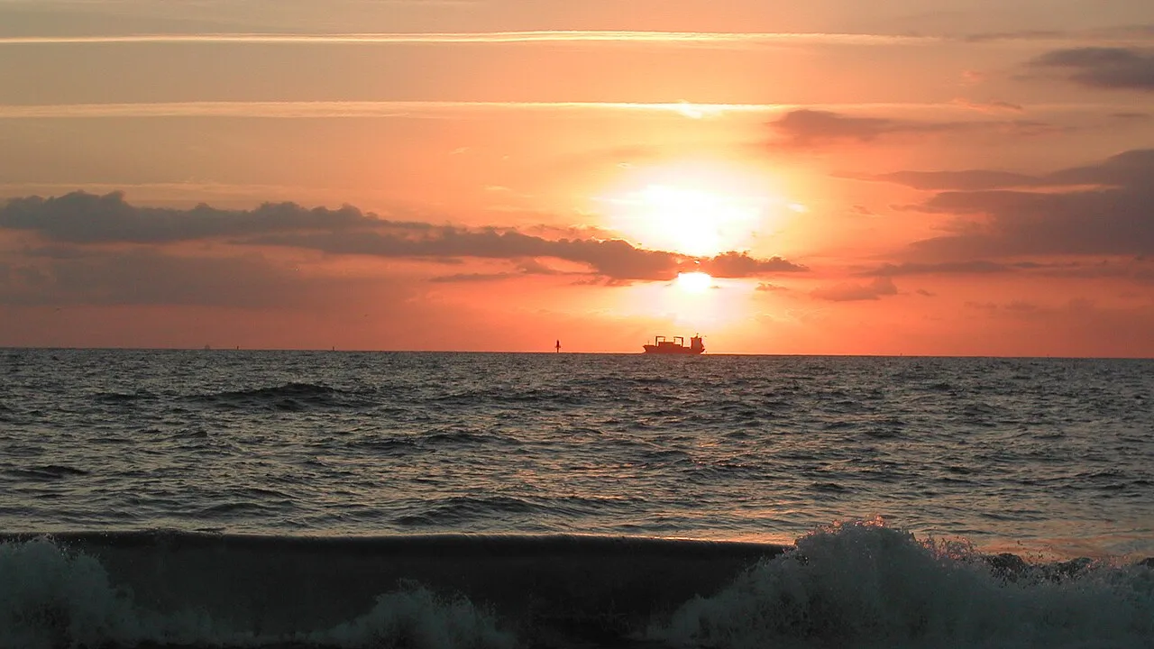 Wave breaking at sunrise, Tybee Island north beach, Georgia