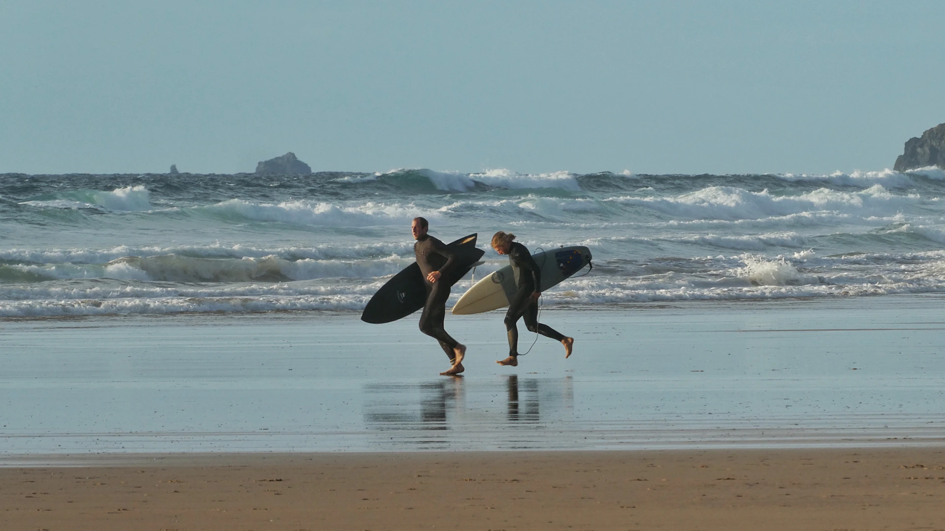 Surfers at Watergate Bay, Cornwall