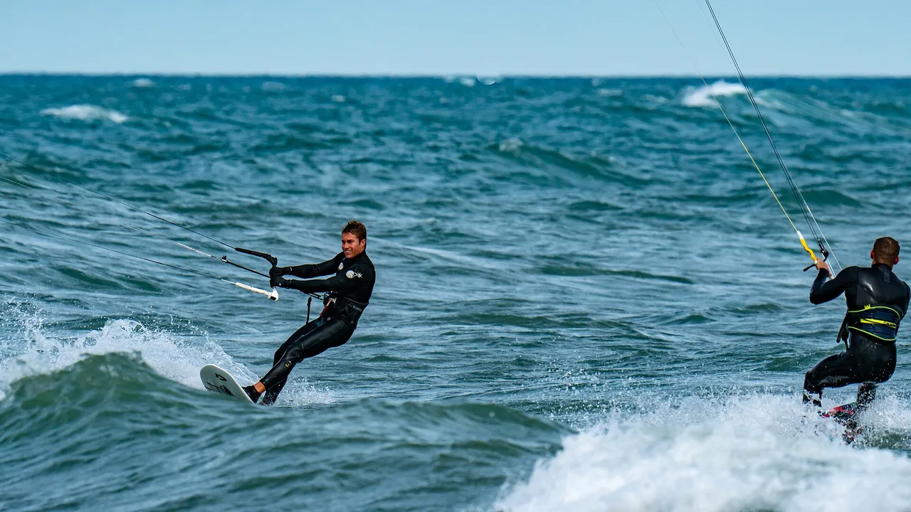 Two kiteboarders riding wind waves on Lake Michigan off Waukegan, Illinois, north of Chicago
